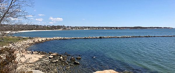 View of the Rocky Neck State Park Jetty, beach and the Giants Neck area shoreline in the Niantic section of East Lyme, Connecticut.