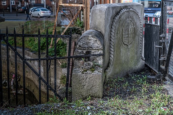 One of two stone plaques commemorating the opening of Spencer Dock in April 1873 either side of the lifting bridge at Sheriff Street