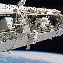 Astronauts assemble the ISS STS-113 Extravehicular Activity (STS113-714-039).jpg