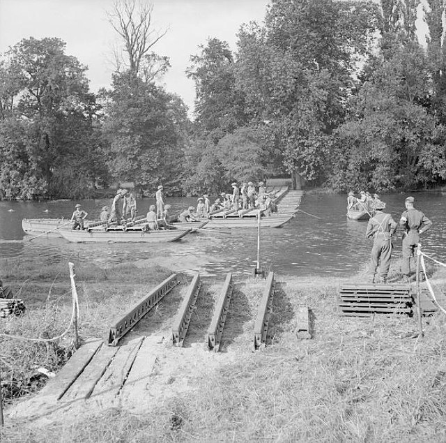 Men of the division construct a pontoon bridge over the River Thames.