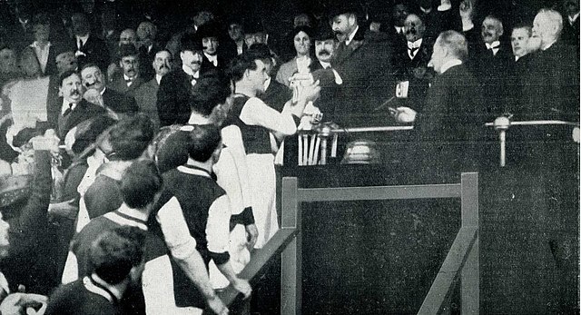 King George V presents the FA Cup trophy to Tommy Boyle of Burnley, April 1914