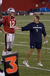 QB Tom Brady and HC Bill Belichick were the pillars of the Patriots dynasty throughout the 2000s and 2010s. During that period (2001-2019), they led the Patriots to nine Super Bowl appearances, winning six, as well as accumulating numerous franchise and league records. Brady is widely regarded as the greatest QB of all time, with Belichick widely regarded as one of the greatest coaches of all time. Together, they are universally known as one of the greatest QB-HC tandems of all time. Tom Brady and Bill Belichick.jpg