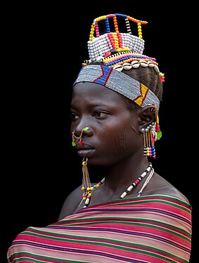 Portrait of a young woman from the Laarim Tribe, Kimotong, Kapoeta State, South Sudan.