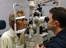 US Navy 060526-N-3532C-058 U.S. Navy Ophthalmologist, Cdr. Jason Ross, conducts an eye exam for a local resident aboard Military Sealift Command hospital ship USNS Mercy.jpg