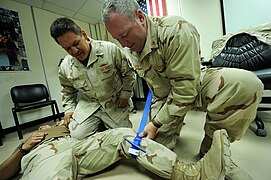 US Navy 101115-N-6070S-115 Cmdr. Richard Payne, right, assigned to Combined Task Force (CTF) 56, and Hospital Corpsman 1st Class Joseph Dronchi, as.jpg