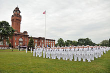 Recruits stand at attention for a special ceremony commemorating the centennial of Great Lakes. US Navy 110701-N-IK959-260 Recruits from Hall of Fame Division 813 stand at attention on Ross Field.jpg
