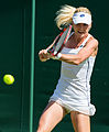 Urszula Radwańska competing in the first round of the 2015 Wimbledon Championships.