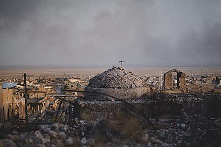 Views in June of 2019 of a cathedral rising above ruined buildings in the old neighborhood of Shingal (Sinjar) 18.jpg