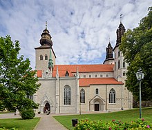 South facade of Visby Cathedral, with the great chapel to the left and the bridal portal to the right Visby domkyrka July 2019 07.jpg