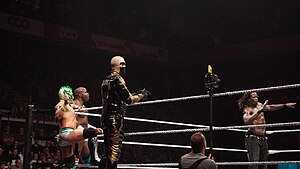 Kalisto at a WWE Live event tour in a 8-Man tag team match teaming with Apollo Crews, Goldust and R-Truth May 12, 2017. WWE Live, Liege, May 12, 2017 2017-05-12 20-46-50 ILCE-6500 DSC03922 (34687312105).jpg