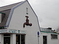 Wall relief of a tap on the plumbers shop at Kerklaan/Poeldijkseweg Wateringen