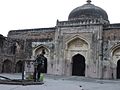 Well and front view of Khair -ul- Manazil, a mosque and later a madarsa built by Maham Anga