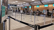 Queue to WestJet check-in counters at Regina International Airport