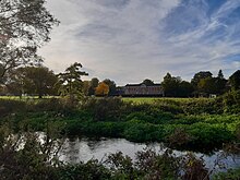 It is said that the pupil who wrote "Domum" threw himself into the River Itchen, which runs through the school grounds. Winchester College River Itchen, playing fields, Science School.jpg