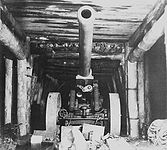 A Japanese Type 89 150 mm gun hidden inside a cave defensive system