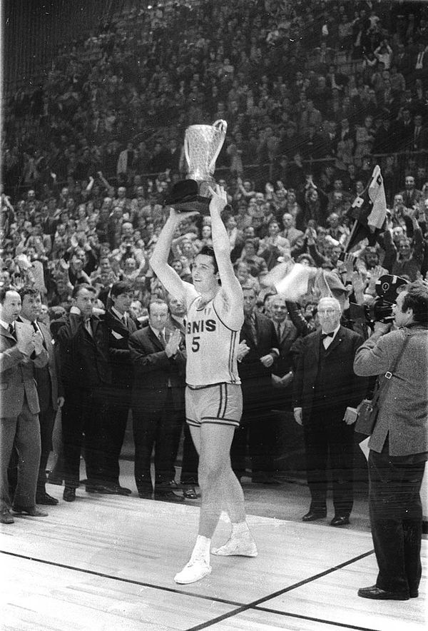 Varese captain Ottorino Flaborea lifts the FIBA European Champions Cup trophy after defeating CSKA Moscow in the final at Sarajevo's Skenderija on 4 A