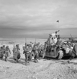 Matilda Tank along with infantry of New Zealand 19th Battalion linking up with the Tobruk garrison, 27 November 1941 19 Battalion infantry.jpg