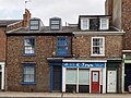 36 and 38, Clarence Street. House and shop. c1845. Grade II listed.