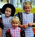 3 young girls wearing traditional Dutch clothes in Spakenburg