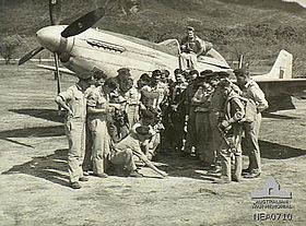 No. 84 Squadron pilots with a Mustang in July 1945