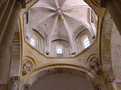 The lantern of the Abbey Church of Sainte-Foy in Conques (11th–12th century) The squinches joining the supporting arches of the lantern are decorated with sculpture of the Apostles. The base is Romanesque, while the lantern itself is later Gothic.