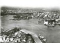 An aerial view of the Sydney Harbour Bridge under construction. Y Watermark removed.