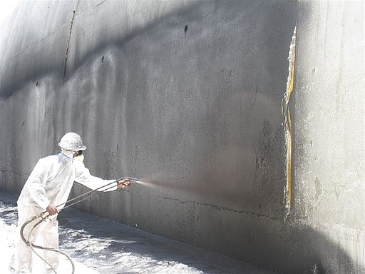 Applying waterproofing material to the outside of a tunnel