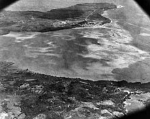 Southern Apra Harbor in 1941, showing the Pan American Airways fuel piers at Sumay, as well as the lagoon that would be constructed into Inner Apra Harbor after the WWII Apra Harbor, Guam in May 1941 (80-G-451193) (cropped).jpg