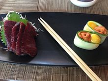 Whale meat sashimi, one of the most controversial Japanese dishes Blue whale meat sashimi and sea urchin sushi.JPG