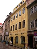 Residential house in closed development and side wings in the courtyard and rear building