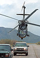 A CBP UH-60 Blackhawk helicopter swoops down on suspects.