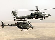 Above, a U.S. Army's AH-64 Apache attack helicopter and below, an OH-58D armed scout helicopter