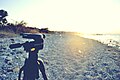 Camera tripod on a beach (Unsplash).jpg