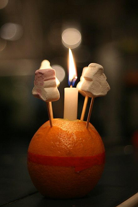 A Christingle, with marshmallows skewered on the cocktail sticks