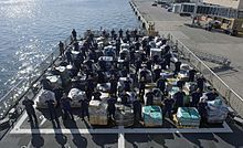 USCGC Hamilton crew next to 26.5 tons of cocaine, 2016 Coast Guard Cutter Hamilton crew stand next to 26.5 tons of cocaine 161215-G-GY119-1039.jpg