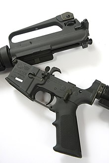 AR-15A2 with the upper and lower receiver opened at the front hinge Colt AR-15 Sporter Lightweight rifle - upper lower break (8378298627).jpg