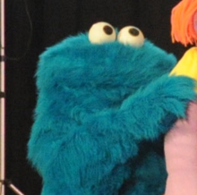 A costume character of Cookie Monster in a 2011 live show. CookieMonster cropped.png