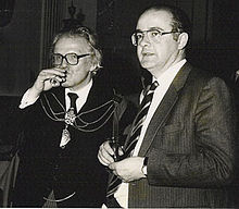 Sir Derek Pattinson and Miln in 1986. Sir Derek is wearing the insignia of Master of the Worshipful Company of Parish Clerks. Derek&Barnaby.jpg