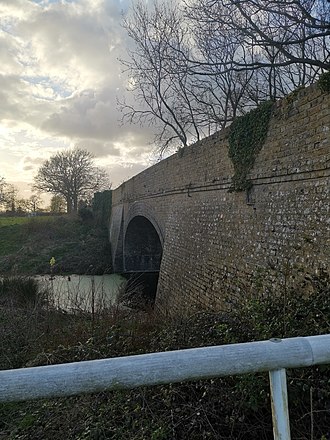 Railway bridge carrying footpath over the line the South of Ingham railway station Disused railway bridge, Ingham Suffolk.jpg