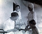 Dr Isabel Kerr administering Chaulmoogra Dr Isabel Kerr European missionary vaccinating a child Wellcome L0069838.jpg
