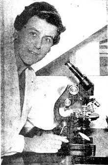 Woman using microscope