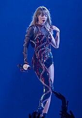 Swift performing "Delicate" on the Eras Tour (2023) Eras Tour - Arlington, TX - Reputation act 1 (cropped).jpg