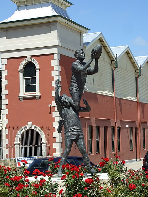 Statue by Robert Hitchcock outside Fremantle Oval of South Fremantle's John Gerovich taking a "specky" over East Fremantle's Ray French in the 1956 WA