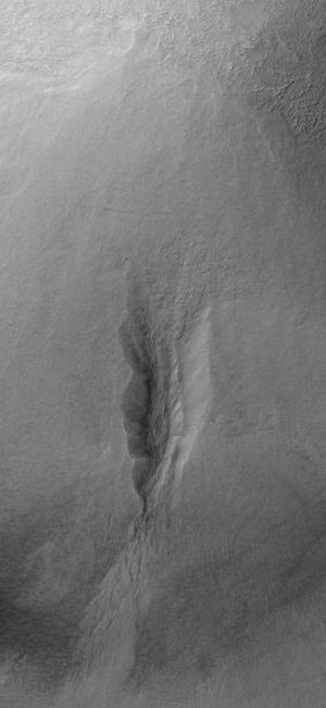 Gully on mound as seen by Mars Global Surveyor, under the MOC Public Targeting Program. Images of gullies on isolated peaks, like this one, are diffic