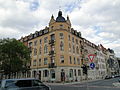 Apartment house in a corner and closed development