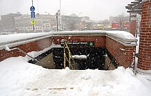 Stairwell entrance into the station from street level, as seen in winter Hunts Point Avenue.jpg