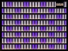 Illuminated white and purple facade of the office building Rohm Semiconductor in Kyoto, Japan.jpg