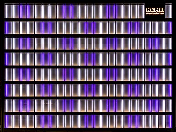 Illuminated white and purple facade of the office building Rohm Semiconductor in Kyoto, Japan