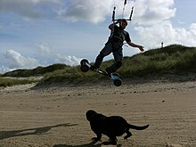 Landboard rider in North Mayo, Ireland, wearing helmet and knee pads Kiteboard.JPG