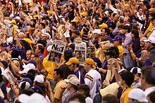 LSU fans celebrate their team's victory by holding up copies of The Times-Picayune newspaper of the next day. LSU OSU 2.JPG